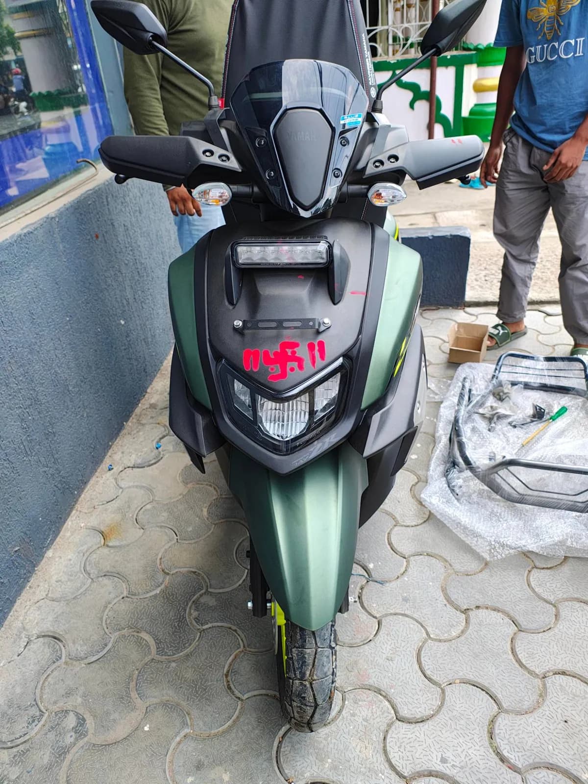 Front view of our Yamaha RayZR 125 rental scooter, with windscreen, hand guards and LED headlamp